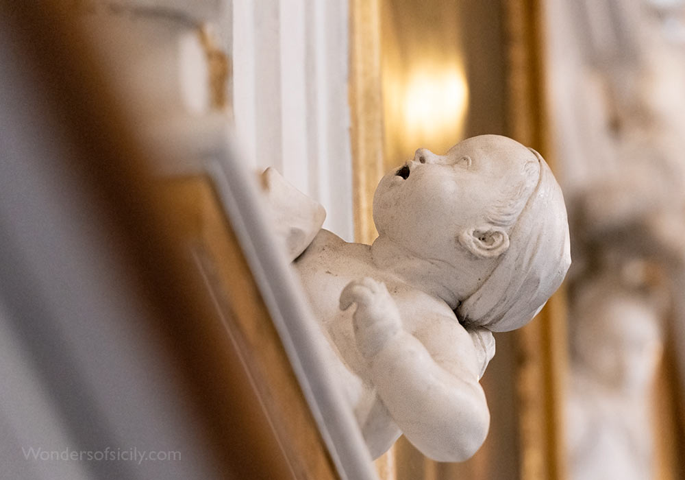 A curious boy in Oratorio del SS. Rosario di San Domenico, Palermo.